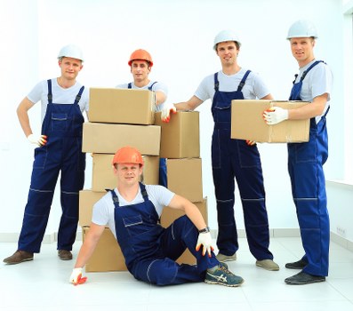 Removal team preparing safely for a move with protective packing materials