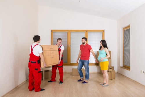 Removal team planning a move in a Hollandpark residential street