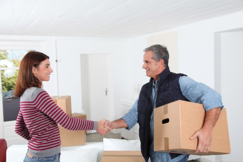 Man and van loading furniture for a Hollandpark home move