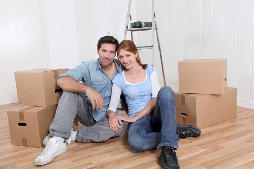 Packed moving boxes and protective supplies ready for collection