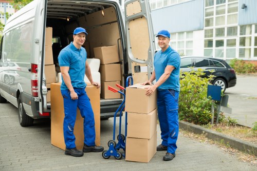 Household furniture and packed boxes ready for transport during a Hollandpark removal
