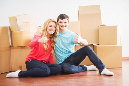 Unpacking boxes in a new Holland Park home after relocation