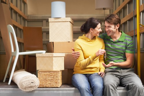 Local removals crew navigating a townhouse move in Hollandpark